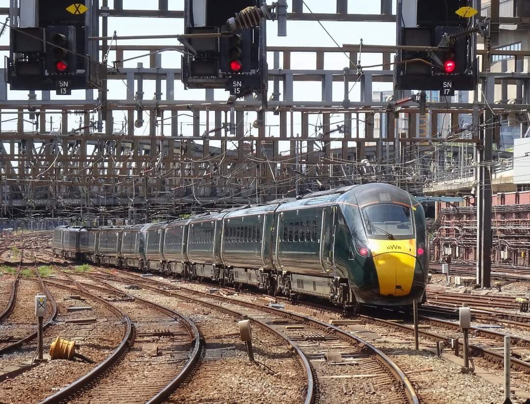 UK train passing railway signals